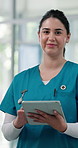 Face, woman and doctor with tablet in hospital for career pride, medical report and schedule. Portrait, person and digital with about us, telehealth update and happy employee for healthcare services