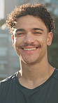Face, athlete and man with smile, city and laughing on break, fitness and pride for exercise routine. Outdoor, runner and person with confidence for sport competition, rest and happy for wellness