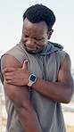 Black man, outdoor and shoulder pain massage from exercise challenge, difficult workout or problem. Stretching, person or athlete with joint inflammation, strain or muscle tension from sports injury.