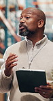 Man, tablet and meeting at warehouse for shipping with agenda, team talk and inventory management. Mature person, tech and logistics with app, storage or notes for supply chain at distribution plant