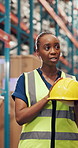 Woman, team and talk at warehouse for helmet for safety training, info and explain with vest for logistics. Person, group and show ppe for supply chain, shipping or discussion at distribution plant