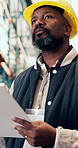 Black man, inspection and logistics in warehouse with checklist, supply chain or quality assurance. Low angle, mature person and clipboard in depot for inventory management, shipping or distribution.