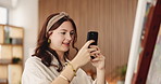 Girl, painter and canvas with smartphone photo in home, hobby or creative process with smile for project. Woman, artist and phone for picture, content creation or social media for talent at apartment