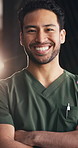 Face, nurse and man with arms crossed, hospital and happy for medical service and career development. Laughing, healthcare worker and person with smile for opportunity to help, flare and wellness