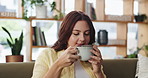 Coffee, smelling and woman on sofa in home with aroma in morning for relax, calm or peaceful. Happy, mindfulness and female person with warm beverage for caffeine scent in living room with memory.