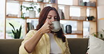 Coffee, thinking and woman on sofa in house with aroma in morning for relax, calm or peaceful. Happy, reflection and female person with warm beverage for caffeine scent in living room with memory.