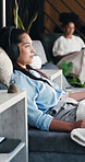 Woman, relax and headphones with IV drip for music, immune booster or therapy in health clinic. Female person, patient and listening with injection for blood infusion, vitamins or nutrition in lounge