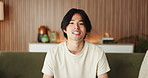 Asian man, face and discussion with video call in living room for online chat, communication or conversation. Portrait, student or POV with sofa for smile, virtual talk or contact with hello in home