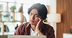 Man, headache and stress in home with laptop, job search struggle and financial crisis from unemployment. Frustrated, Asian person and migraine in apartment with computer, bad news and loss of work.