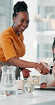 Creative agency, handshake and woman in meeting, job interview or collaboration for project. People, shaking hands or employees in office, welcome or feedback for proposal, recruitment and agreement