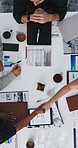 Documents, meeting and business people in office shaking hands for finance deal, agreement or partnership. Top view, tablet and financial manager with client for handshake with investment contract.