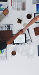 Documents, tablet and business people in office shaking hands for finance deal, agreement or partnership. Top view, meeting and financial manager with client for handshake with investment contract