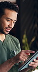 Tablet, man and nurse in clinic with service, telehealth or medical research with report. Digital technology, professional and male healthcare worker with online consultation for wellness app.