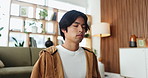 Asian man, breathing and meditation with yoga in home for fitness, spiritual healing and chakra. Male person, inhale and eyes closed with holistic balance, inner peace and mental health for wellness
