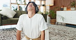Yoga, headphones or man in living room with stretch, mindfulness or music streaming in wellness activity. Cobra, tech or person in house with mat, zen or mobility improvement with holistic podcast.