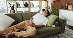 Man, stomach ache and sofa with diarrhea, pain or gastrointestinal reflux in home. Male person, belly or sore tummy with cramp for food poisoning, indigestion or sickness in house