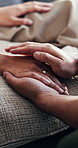 Person, holding hands and comfort with empathy for understanding, support or trust in home. Closeup, people and touch with care, sympathy or commitment for marriage, love or emotional help in house