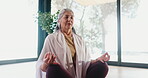 Calm, meditation and yoga with mature woman in studio for balance, mental health or wellness. Mudra, quiet and zen with yogi person on floor for awareness, inner peace or mindfulness exercise
