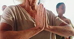 Meditation, instructor and hands in class, namaste and routine for mindfulness, wellness and healing. Prayer, session and elderly people with spiritual awareness, inner peace and stress relief