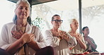Elderly people, meditation and breathwork in yoga class for wellness, spiritual awareness and healing. Senior women, lotus pose and hands on chest for mindfulness, zen energy and holistic health.