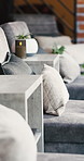 Modern, interior and setup with furniture at spa lounge for peace, calm morning and holiday. Layout, couch and candlelight with table for comfort, minimalistic design and decor aesthetic at resort