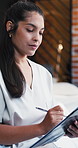 Nurse, woman and writing in clinic with clipboard, health insurance application and administration. Healthcare worker, person and form in workplace for medical aid policy, checklist review or survey.
