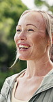 Breathing, fitness and woman with smile, outdoor and relax for wellness, stress relief and exercise. Calm, nature and person in park, workout and routine for healthy lungs, balance and reflection