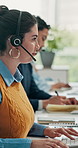 Call center, computer and woman typing for customer care, support service or coworking in office. Hotline, headset and consultant with keyboard for help, assistance and follow up email with feedback