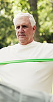 Fitness class, resistance band and senior man at park for exercise, stretching or workout. Elderly person, equipment and training outdoor for health, wellness and active retirement with coach