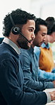 Computer, headset and reading with man in call center for problem solving, solution or support. Communication, customer service and information with agent at desk in office for assistance or help