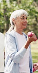 Fitness class, dumbbells and old woman walk in nature for cardio, muscle development and health. Elderly group, weightlifting or steps at park for strength training, workout or exercise in retirement