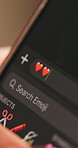 Heart emoji, phone screen and social media with person typing message for love or romance. Chatting, dating app and texting with mobile user closeup from above for connection or flirting online