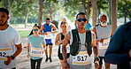 Running, marathon and people outdoor for race, endurance challenge and fitness event. Sports, athlete and men and women in park for runners contest, competition and exercise for cardio workout