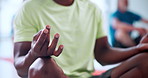 Hands, meditation and lotus at yoga class on floor with breathing exercise at wellness club. People, holistic fitness and mudra for awareness, zen and mindfulness with group for course at gym