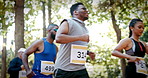 Running, fitness and group of people outdoor for marathon, endurance challenge and competition. Sports event, athlete and low angle of men and women in park for runners contest, training and exercise