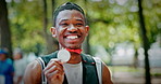 Fitness, nature and face of man at marathon, achievement or running workout with competition. Happy, medal and portrait of male athlete with pride for winning at race outdoor in park with reward.