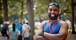 Crossed arms, outdoor and face of man at race, fitness or running workout with competition. Happy, medal and portrait of male athlete with pride for winning at marathon in park with reward in nature.