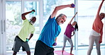 Stretching, senior people and dumbbells in class, flexibility or workout to prevent muscle stiffness. Gym, old women and exercise with elderly men, together and training with equipment and active