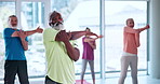 Pilates class, people and fitness with stretching, spiritual wellness or flexibility in gym. Mature man, retirement and group balance in health club with warm up for yoga, mobility or elderly care