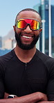 Black man, arms crossed and fitness in city with sunglasses for wellness, smile and confidence in road. African person, runner and happy in street with pride, exercise and shades in urban town