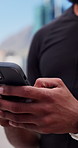 Cellphone, cyclist and hands of man outdoor with texting, networking or communication on mobile app. Technology, sports and athlete with phone for chatting, contact or social media with fitness.