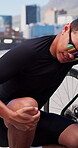 Cyclist, bicycle and man with knee pain in city for sport injury, tendon inflammation and sprain. Fitness, bike and athlete with sore leg on bridge from cycling mistake, muscle fatigue and joint ache