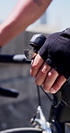 Sports, bicycle and hands of man outdoor with brake for cycling, exercise and workout on road. Fitness, athlete and person on bike for practice, active hobby and training for challenge in city