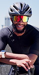Face, black man and cyclist with helmet outdoor for fitness, exercise and triathlon competition. Portrait, male person and happy with sunglasses for sports safety, cycling challenge and race training