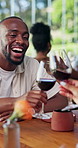 Restaurant, couple and man with wine cheers on date for bonding, conversation and anniversary. Happy, dating and person with drink, alcohol and toast for valentines day, fine dining and romantic meal