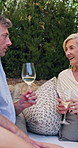 Laugh, conversation and senior couple with wine at outdoor restaurant for anniversary with bonding. Smile, love and elderly woman with man for alcohol drink at valentines day with romantic date.