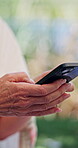 Old woman, hands and typing outdoor with phone, browsing internet and social media for online news. Senior person, scroll and search with tech for text message, reading digital article and blog post.