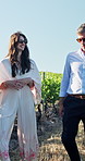 Nature, walking and people in vineyard for wine tasting, travel experience and tourism on holiday. Farm, outdoor and man and woman in countryside for vacation, tour guide and winery information