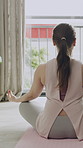 Morning, meditation and back of woman in home for stress relief, mindfulness and balance. Yoga mat, house and person with lotus pose for holistic exercise for health, wellness and calm energy