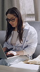 Home, dog and woman with laptop, glasses and freelance project on website, creative and copywriting. Typing, online and person with eyewear for article, remote work and affection for pet in lounge